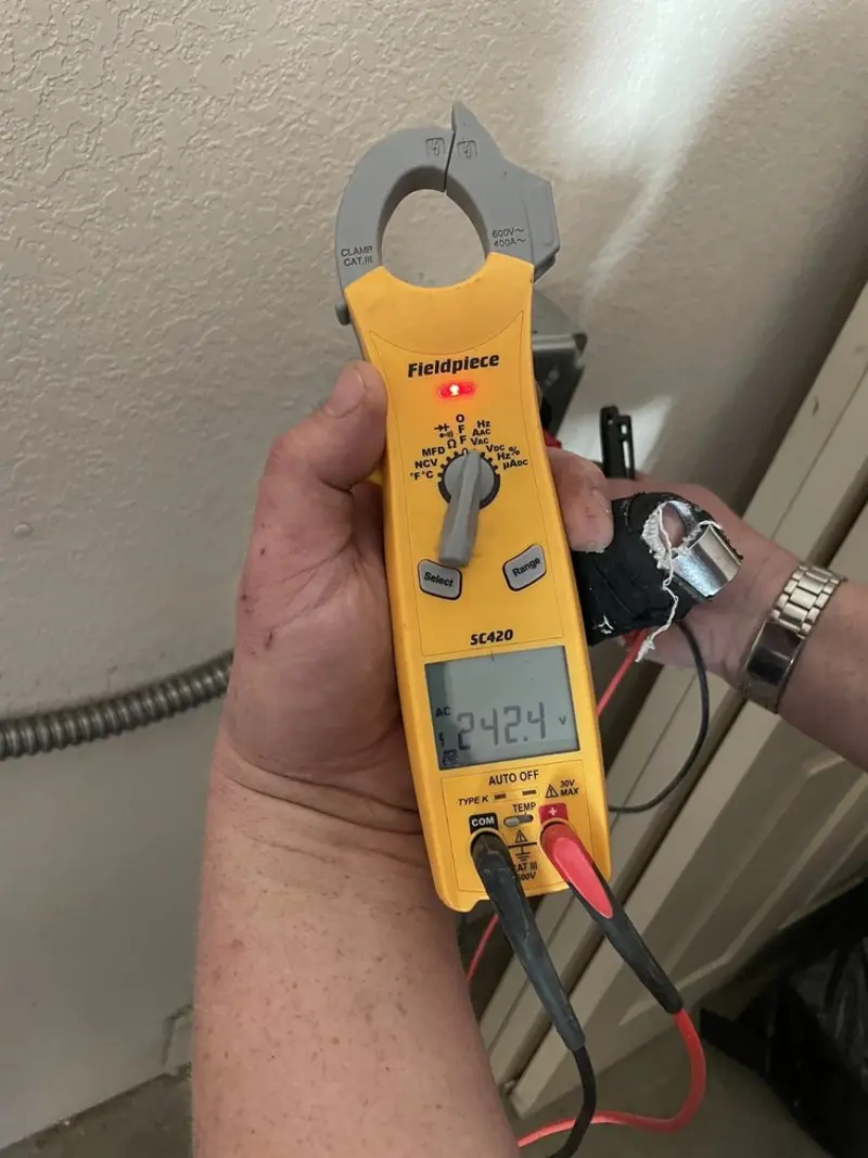 Voltage testing with clamp meter during Generator Installation in Omak
